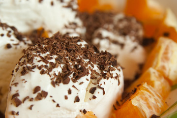 Ice-cream with chocolate and slice of fruit