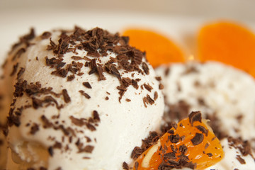 Ice-cream with chocolate and slice of fruit