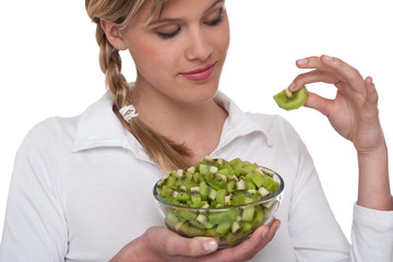 Healthy lifestyle series - Woman holding slice of kiwi