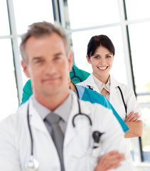 Female doctor in a row smiling at the camera