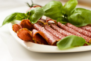 Salami with fresh basil