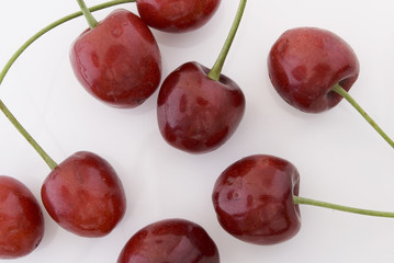 Red cherries on a white background.