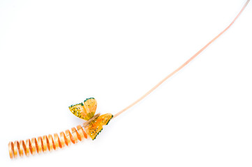 Orange spiral flower decoration and butterfly clip