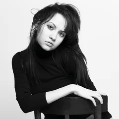 Zelfklevend Fotobehang Beautiful woman in black jacket © Egor Mayer