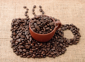 Cup of and from coffee beans
