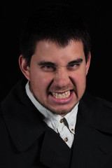 Angry male portrait isolated on black background