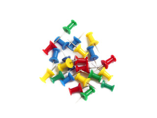 Fototapeta premium Group of colored thumbtackes, isolated over white
