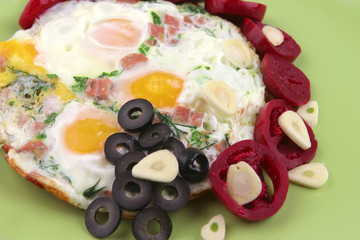 fried eggs and red eggplant
