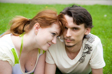 man and woman on the green grass