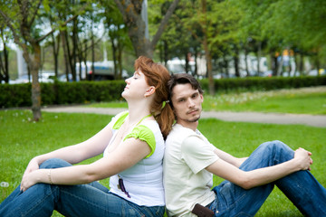 man and woman on the green grass
