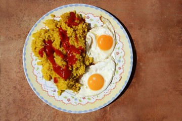 Delicious rice with tomato and two eggs