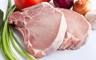 raw pork chops with vegetables