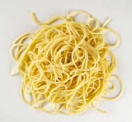 Boiled spaghetti on white background - obrazy, fototapety, plakaty