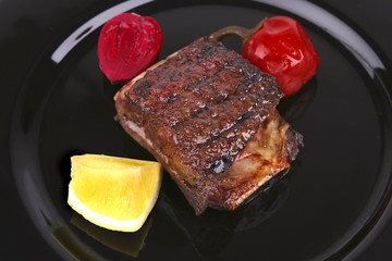 ribs on black dish