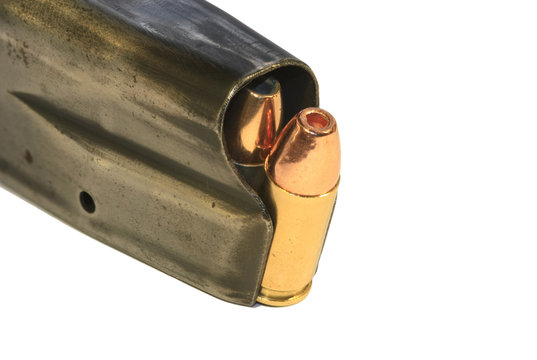 9mm bullets in a magazine on white