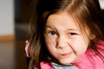 portrait of a little girl wearing striped t-shirt