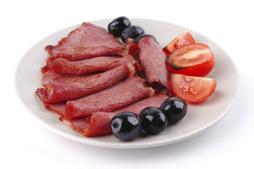 sliced served sausage with raw tomato