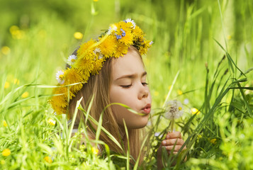 Portrait of a little girl in the grass