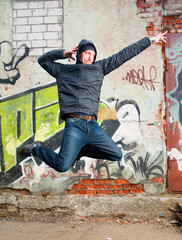 cool looking dancer posing on a grunge background