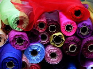 Rolls of multi-coloured fabric