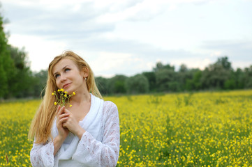 Fototapeta premium The girl with a yellow flower