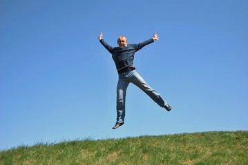 men with skipping on a green meadow
