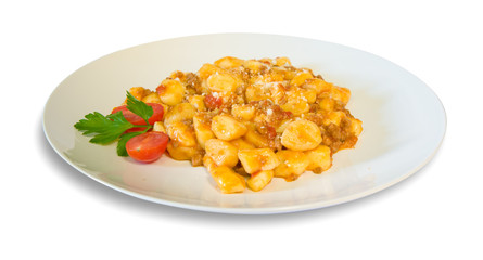 Potato dumplings with meat ragout and cherry tomatoes