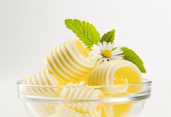 Butter curls in a glass bowl