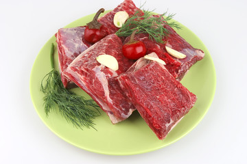 raw ribs on green dish