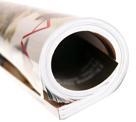 Woman's rolled glossy magazine