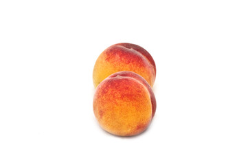 Two isolated peaches