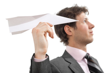 Businessman with paper airplane