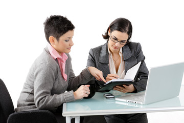 Young businesswomen talking