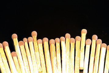 Bunch of matches aligned on black