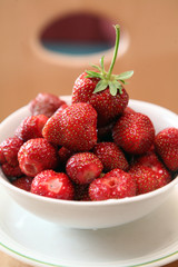 red nice strawberry on saucer