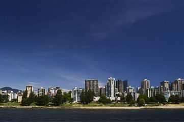 Fototapeta na wymiar Beachfront apartments with green space