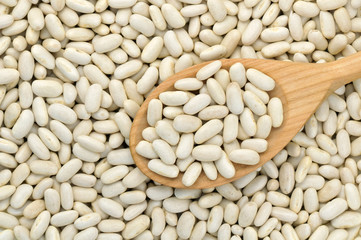 White beans with wooden spoon