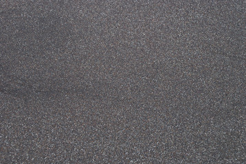 Background of black sand.