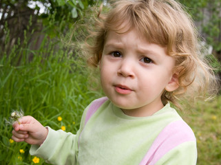 Nice girl with a dandelion