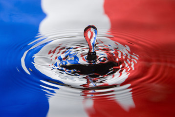 Water droplet against a French flag