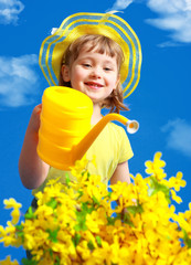 Beautiful little baby girl and yellow flowers