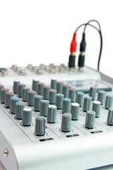Obraz premium Controls of small sound mixer console with plug isolated