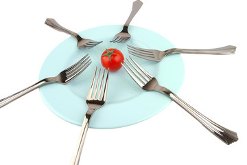forks and tomat on dish