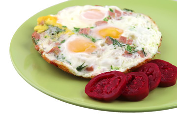 fried eggs and red eggplant