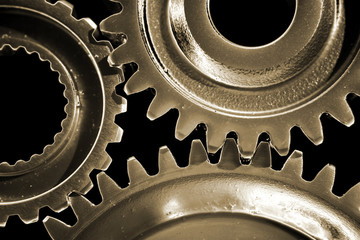 Closeup of three gears binding together