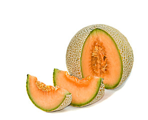 Melon and its segments isolated on white background