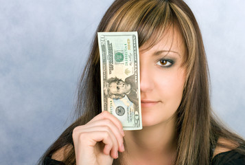 Pretty young woman with dollar