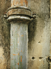 rusty water pipe on grunge wall