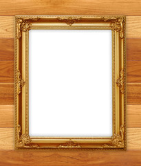 golden picture frame on wooden wall