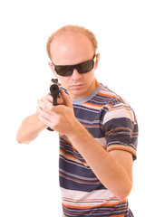 Young man with gun isolated